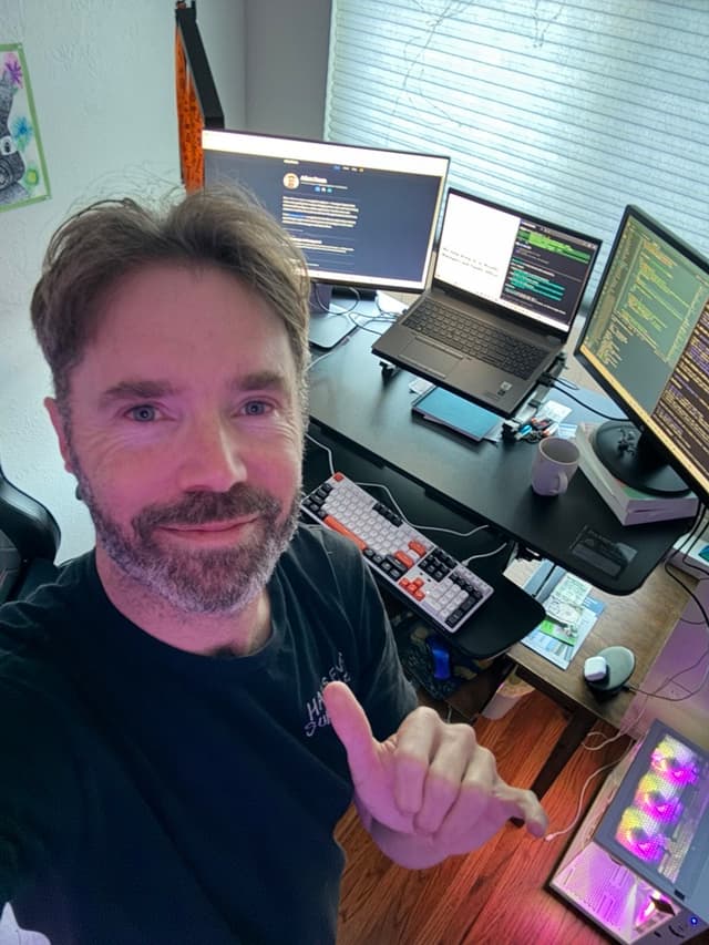 Adam Daum working at his desk